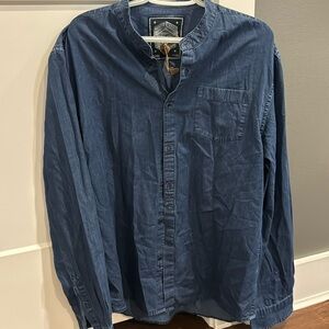 Random Access. Men’s, dark jean, no collar, button down shirt.